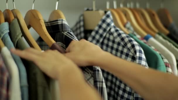Close Shot Hands Taking Shirts Shirts Coat Rack – stockvideo