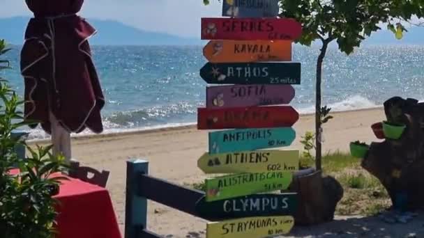 Sea Sandy Beach Greece Signs Showing Directions Distance Different Cities — Stock videók