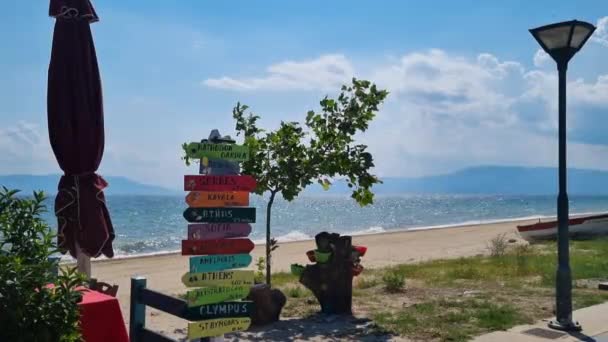 Sea Sandy Beach Greece Signs Showing Directions Distance Different Cities — Stock videók