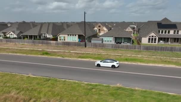 White Tesla Model Electric Car Drives Road Texas Aerial Orbit — Stock video