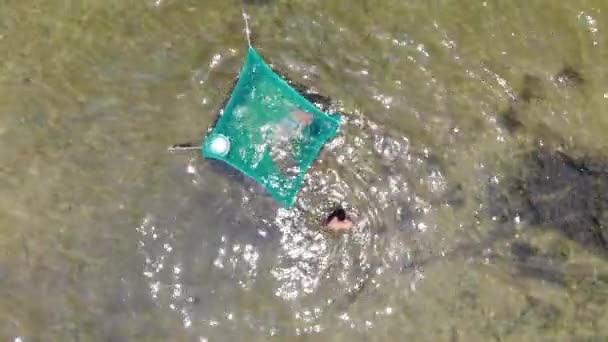 Aerial Top View Two Men Fishing Dive Water Using Trap — Stockvideo