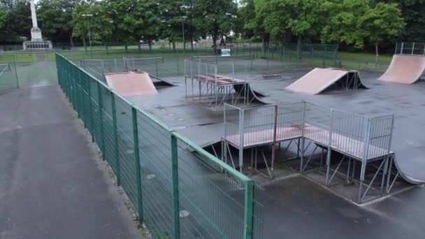 Aerial View Low Flying Fenced Skate Park Ramp Empty Closed — Stockvideo