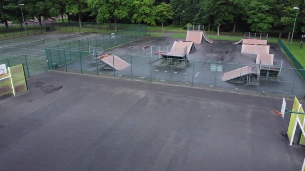 Aerial View Flying Fenced Skate Park Ramp Basketball Court Empty — 图库视频影像