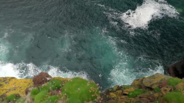 Waves Gently Crash Rocks Base Sea Cliff Deep Teal Coloured — Video Stock