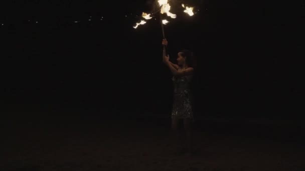 Female Thai Dancer Pirouetting While Twirling Waving Fire Torch Dance — Video