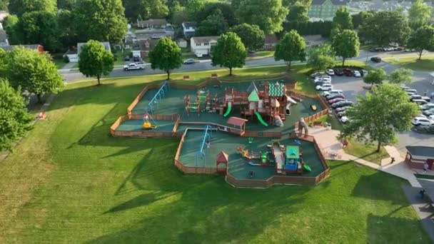 Large Outdoor Playground Children Aerial Orbit American Town Golden Hour — Stok video