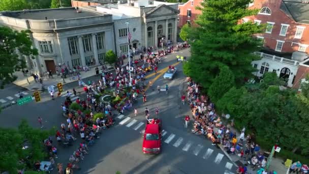 Large Crowd Watches Parade Patriotic Theme American Flag Town Square — Stock video