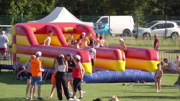 Kids Jumping Bouncing Castle Screaming Joy Looking Full Length Body — Vídeo de stock