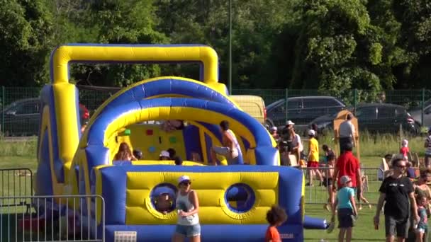 Kids Playing Inflatable Attraction Playground Sport Association Gathering Static — Stockvideo