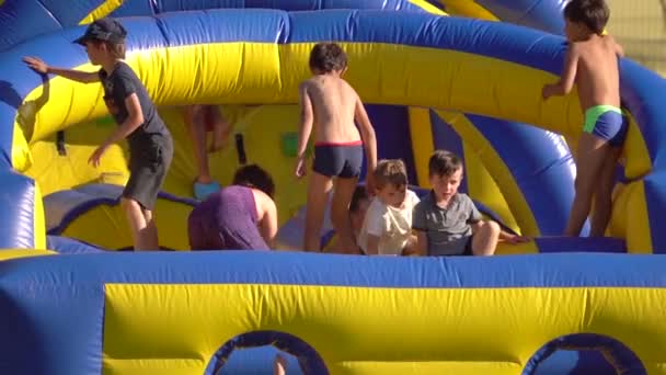 Kids Jumping Playing Bounce House Slow Motion — Stock Video