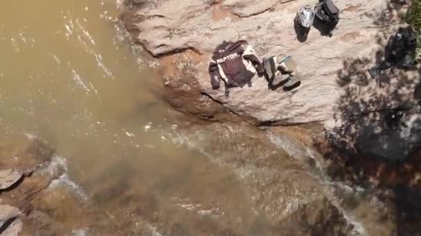 Group Motorcyclists Drying Out Alongside River Ascend Small World View — Stockvideo