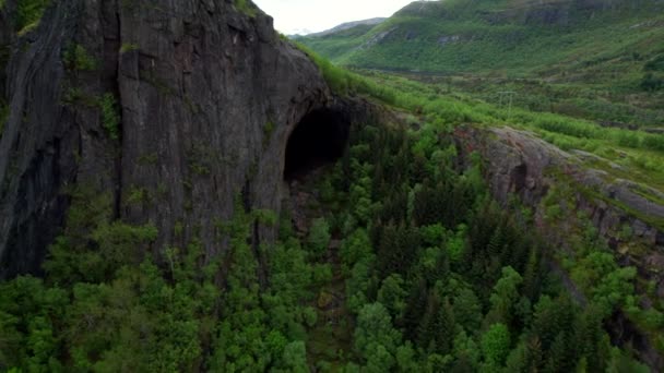 Aerial Flyover Hidden Cave Mountain People Standing Next Entrance Helgeland — стокове відео