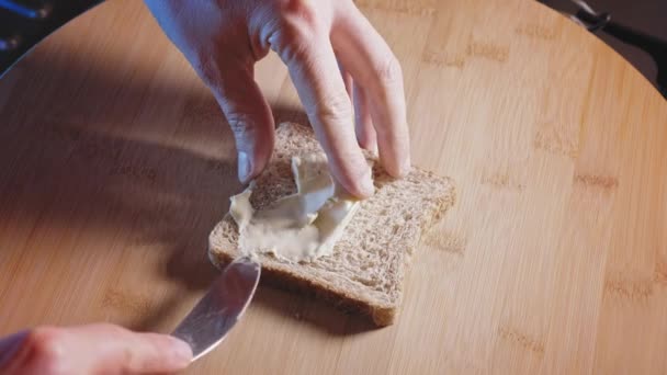 Hands Spread Creamy Cheese Triangle Whole Wheat Bread High Angle — 图库视频影像