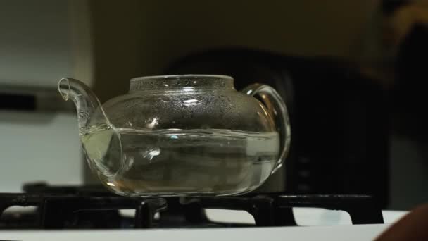 Front View African American Man Taking Boiling Glass Tea Pot — Vídeo de Stock