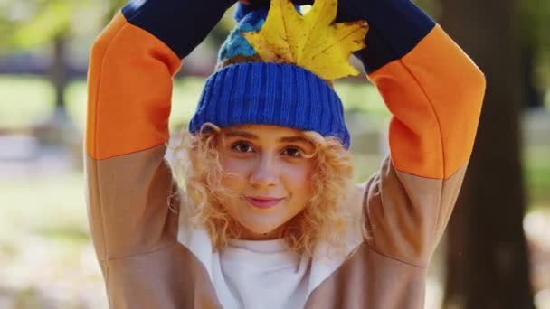 Happy Young Woman Dry Yellow Leaf Her Hat Outstretching Hands — Stock Video