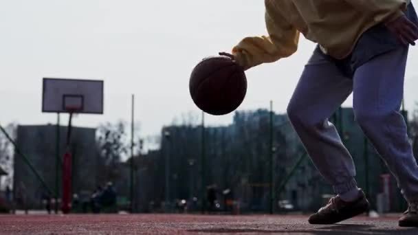 Young Girl Basketball Player Training Exercising Outdoors Local Court Bouncing — Stockvideo