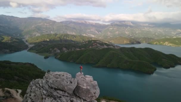 Aerial Drone Footage Man Standing Rocks Sunny Day — Vídeo de Stock