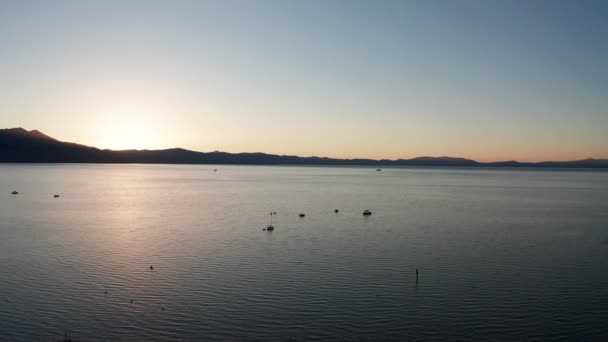 Rising Aerial Shot Boats Lake Tahoe Sunset — Wideo stockowe