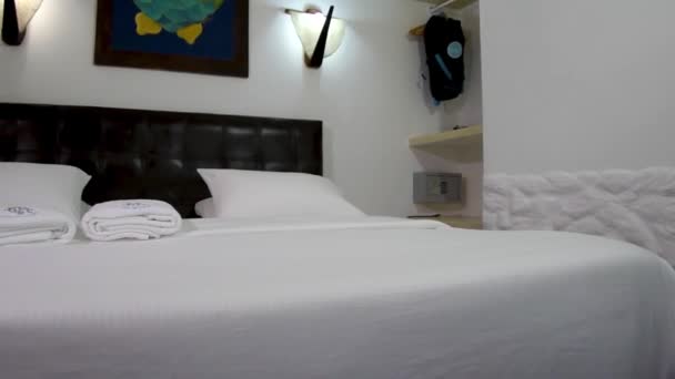 White Hotel Bedroom Empty Clean Two White Pillows Towels Sheet — Stockvideo