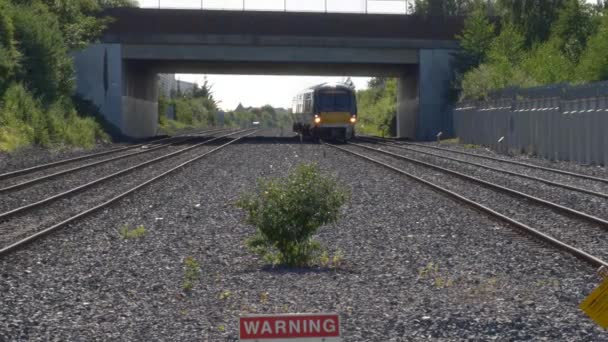 Dublin Ireland Train Approaching Station Warning Sign Trespass Railway Handheld — стоковое видео