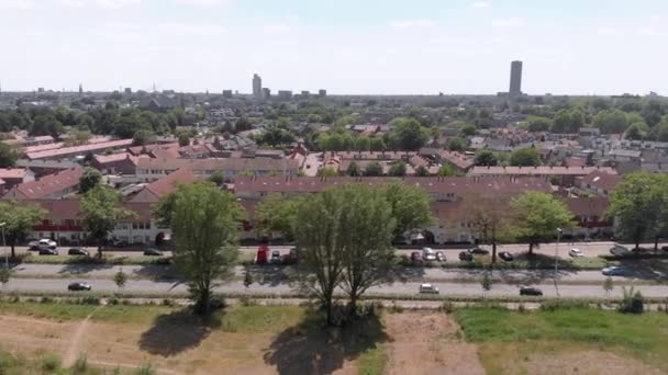 Drone Shot Showing Aerial View Dutch Neighborhood Bordering Busy Road — Video