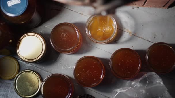 Top View Pure Honey Glass Jars Freshly Extracted Golden Liquid — Video