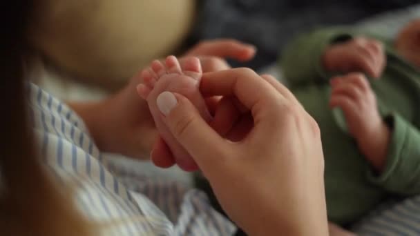 Mother Caressing Foot Baby Her Hands — Stock videók