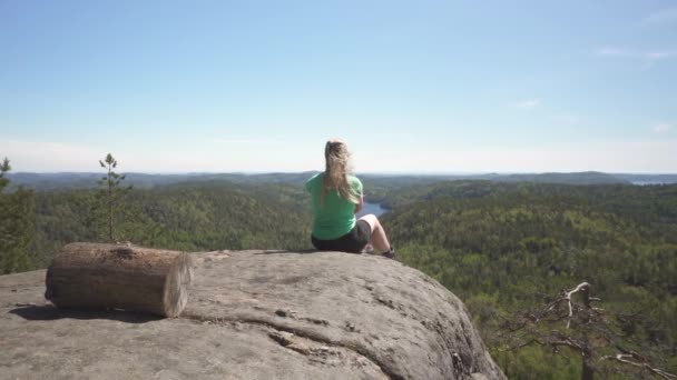 Girl Enjoying Idyllic View Dense Forest Sitting Clifftop Southern Norway — Stockvideo