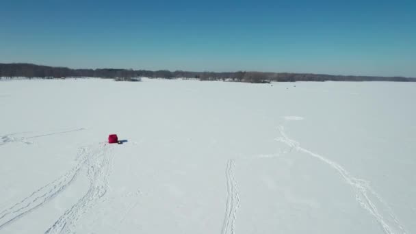 Aerial View Frozen Lake Snowmobile Driving Frozen Lake Fishing Hut — 图库视频影像