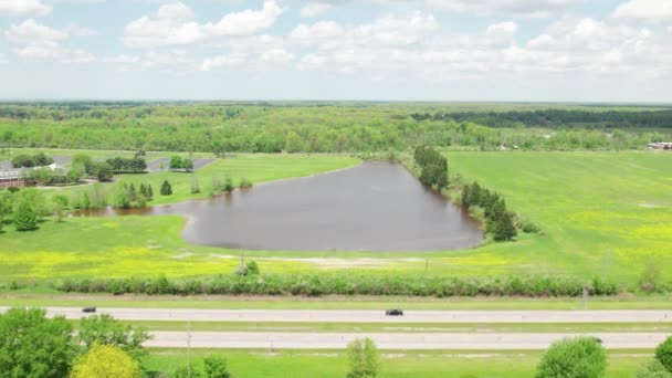 Drone Flying Farmland Approaching Lake — Stock videók