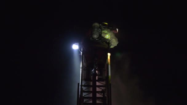 Brave Firefighter Climbing Ladder — Stockvideo