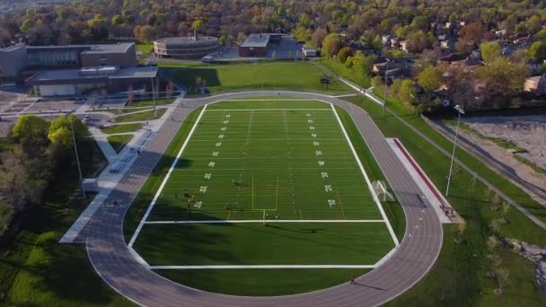High School Track Football Soccer Field Surrounded Neighborhood Homes Drone — Stock Video