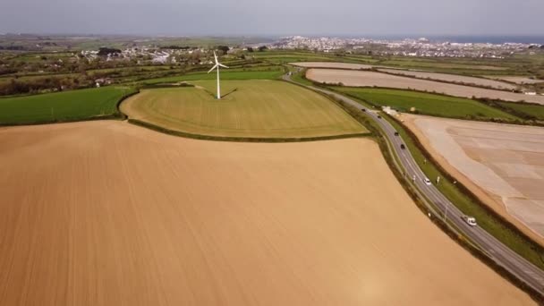 Wind Turbine Amidst Green Countryside — Wideo stockowe