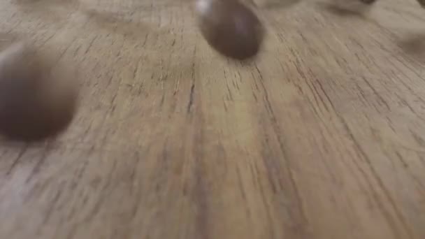 Coffee Beans Dropped Bouncing Wooden Table Falling Container Collects Them — Stock video