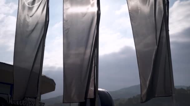 Tilt Shot Mercedes Benz Banners Blown Wind Sunlight — Vídeo de Stock