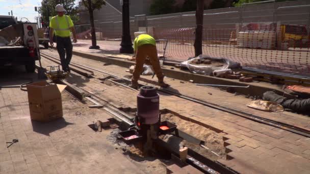 Construction Workers Working Railroad Tracks Background While Molten Steel Heats — Video