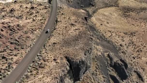 Aerial White Truck Driving Rocky Desert Terrain Highway Central America — Video