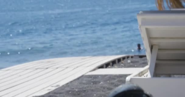 View Swim Shoe Beach Chair Person Swims Ocean Distance Santorini — ストック動画