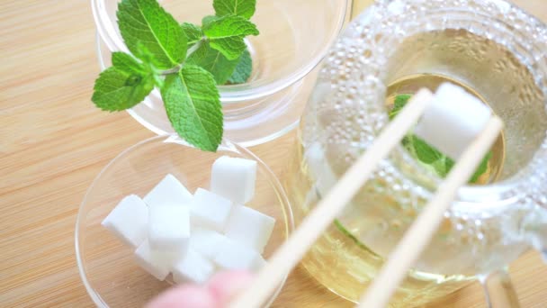 Adding Sugar Cubes Mint Tea — Video Stock