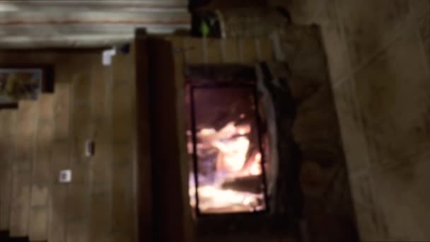 Handheld Shot Focused Fireplace Burning Hands Wine Glasses — Stock Video