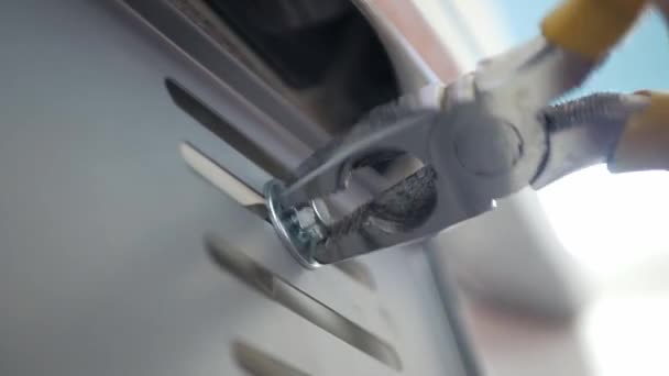 Close View Mechanician Use Pliers Tighten Bolt Car License Number — стоковое видео