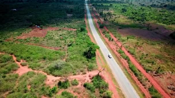Caravan Vehicle Traveling Remote Road Uganda East Africa Aerial Shot — 图库视频影像
