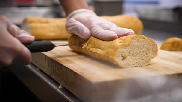 Chef Slices French Bread Baguette Slow Motion Close — Stock Video