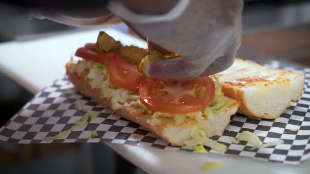 Sandwich Prep Placing Sliced Dill Pickles Crusty French Bread Building — Video Stock