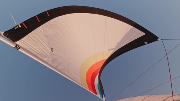 Top View Deck White Sail Waving Light Breeze Blue Sky — Vídeo de stock