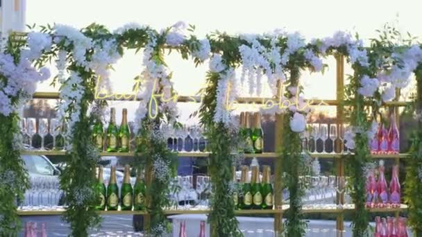 Wedding Rack Wine Bottles Surrounded Wedding Decor Slowmotion — Stockvideo