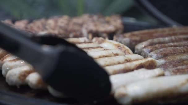 Close Grill Master Flipping Sausages Guests Gas Bbq Dinner Party — Wideo stockowe