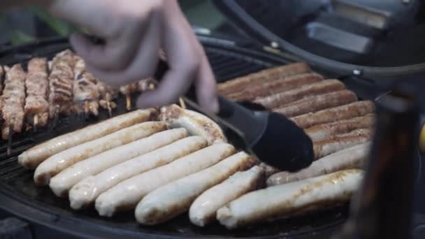 Grill Master Flipping Sausages Guests Gas Barbecue — Stock video