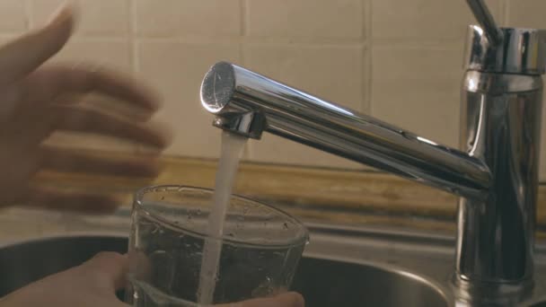Two Hands Turn Water Kitchen Sink Faucet Fill Glass Water — Wideo stockowe