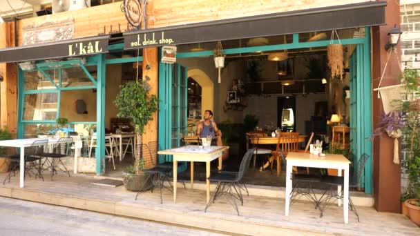 Male Tourist Sitting Alone Cafe Looking Nicosia Cyprus Viewed Street — Wideo stockowe